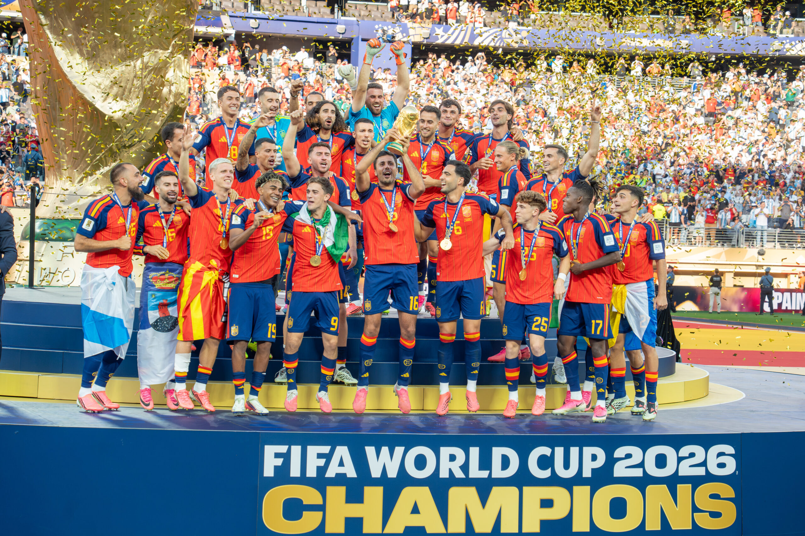 Spain players celebrating and lifting the World Cup trophy after winning the 2026 final